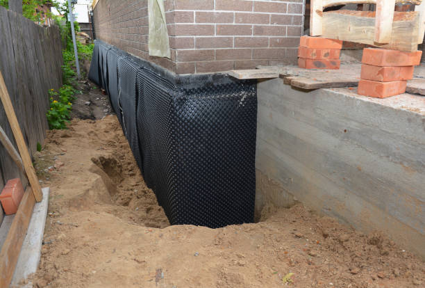Happy homeowners after waterproofing job in Mooreland